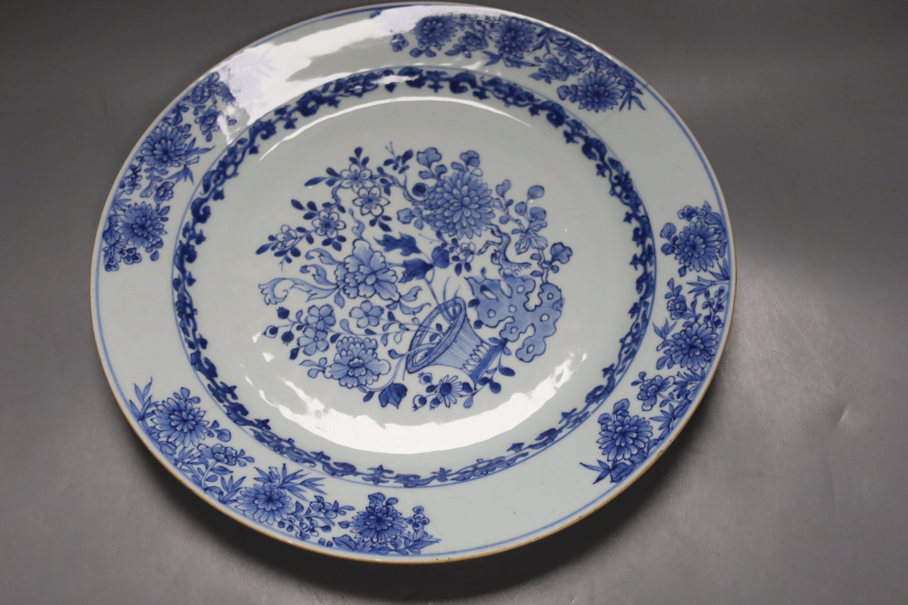 Two 18th century Chinese blue and white dishes and a water pot, largest item 34.5 cms diameter.
